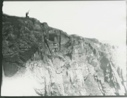 Image of Duck Hawk Cliff, MacMIllan in nest, Oscar with Gun